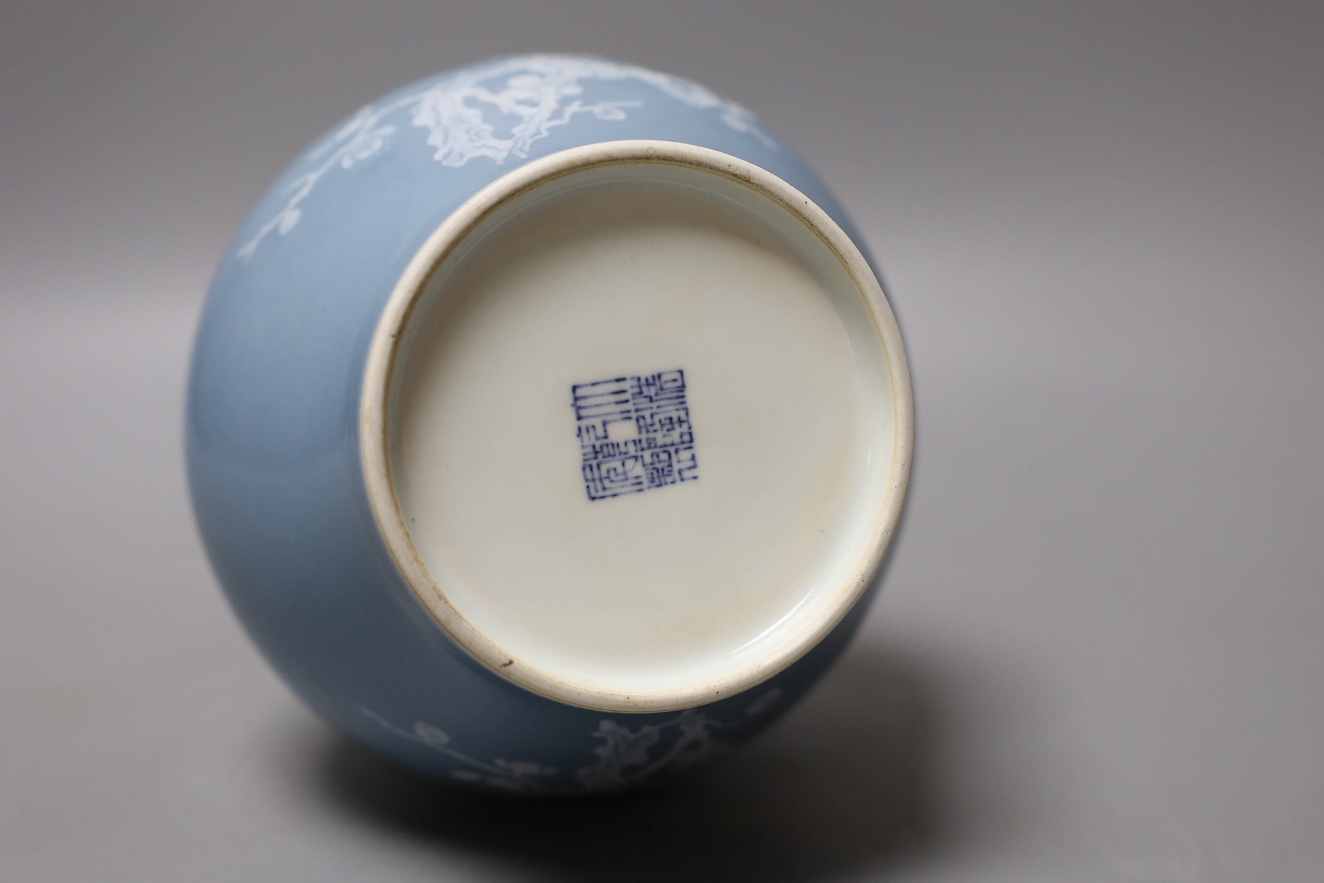 A Chinese claire de lune glazed white slip decorated vase - 25cm high